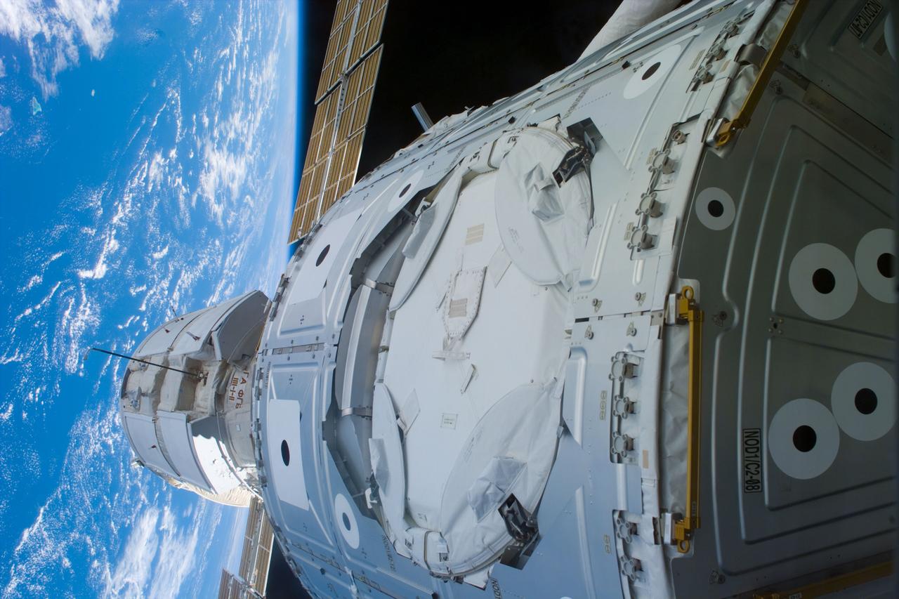 S88-E-5050 (12-07-98) --- Just a few feet away from the camera lens onboard Endeavour, the Russian-built Zarya control module and the U.S.-built Unity connecting module are connected in the shuttle's cargo bay. Using the Endeavour's 50-ft.-long Canadian-built robot arm, astronaut Nancy J. Currie, working from the aft flight deck, plucked Zarya out of orbit at 5:47 p.m. (CST), Dec. 6. The craft had been orbiting Earth for a little over 16 days prior to the grapple and subsequent docking to Unity. This image was recorded with an electronic still camera (ESC) at 00:24:53 GMT, Dec. 7.