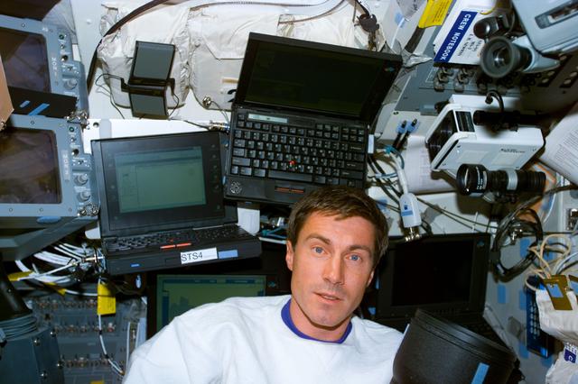 NASA image: Krikalev on the aft flight deck with laptop computers