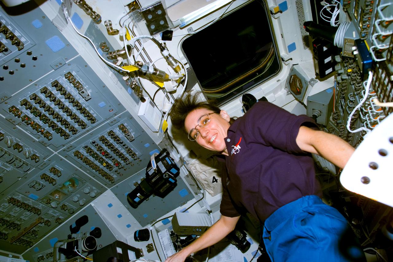S88-E-5164 (12-08-98) --- Astronaut Nancy J. Currie spent a great deal of time at controls on the aft flight deck of the Space Shuttle Endeavour during the STS-88 mission. Earlier in the mission, from a nearby station, Currie performed some precise maneuvers with the remote manipulator system (RMS)in mating the U.S.-built Unity module and the Russian-built Zarya. This photo was taken with an electronic still camera (ESC) at 23:18:23 GMT, Dec. 8.
