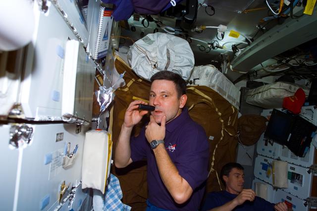 NASA image: Cabana shaves on middeck