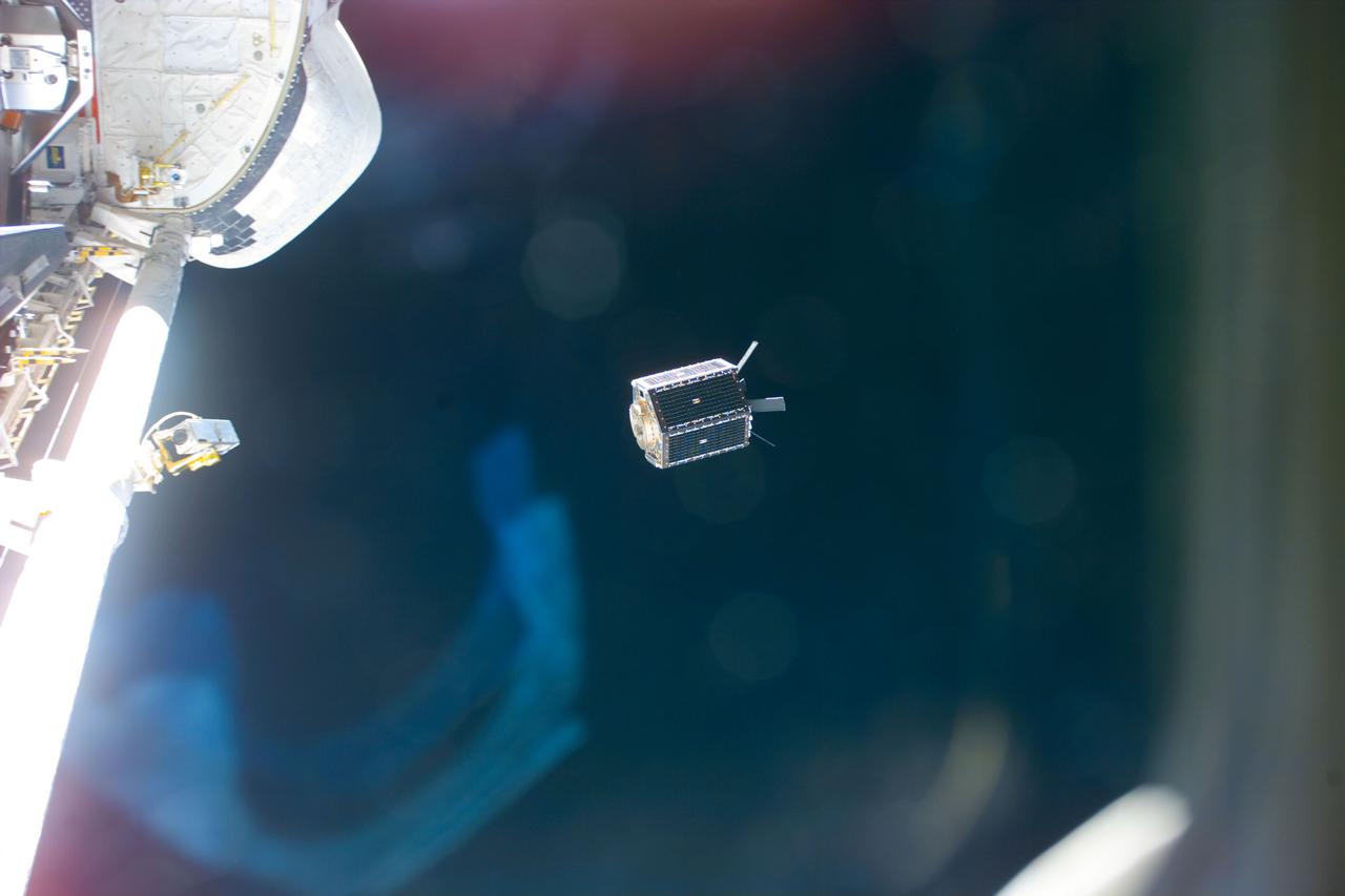 S88-E-5172 (12-15-98) --- MightySat, a 705-pound U.S. Air Force/Phillips Laboratory satellite, moves away from the Space Shuttle Endeavour.  The tiny satellite was ejected from a canister in the shuttle's cargo bay.  The photo was taken with an electronic still camera (ESC) at 02:13:54 GMT, Dec. 15.