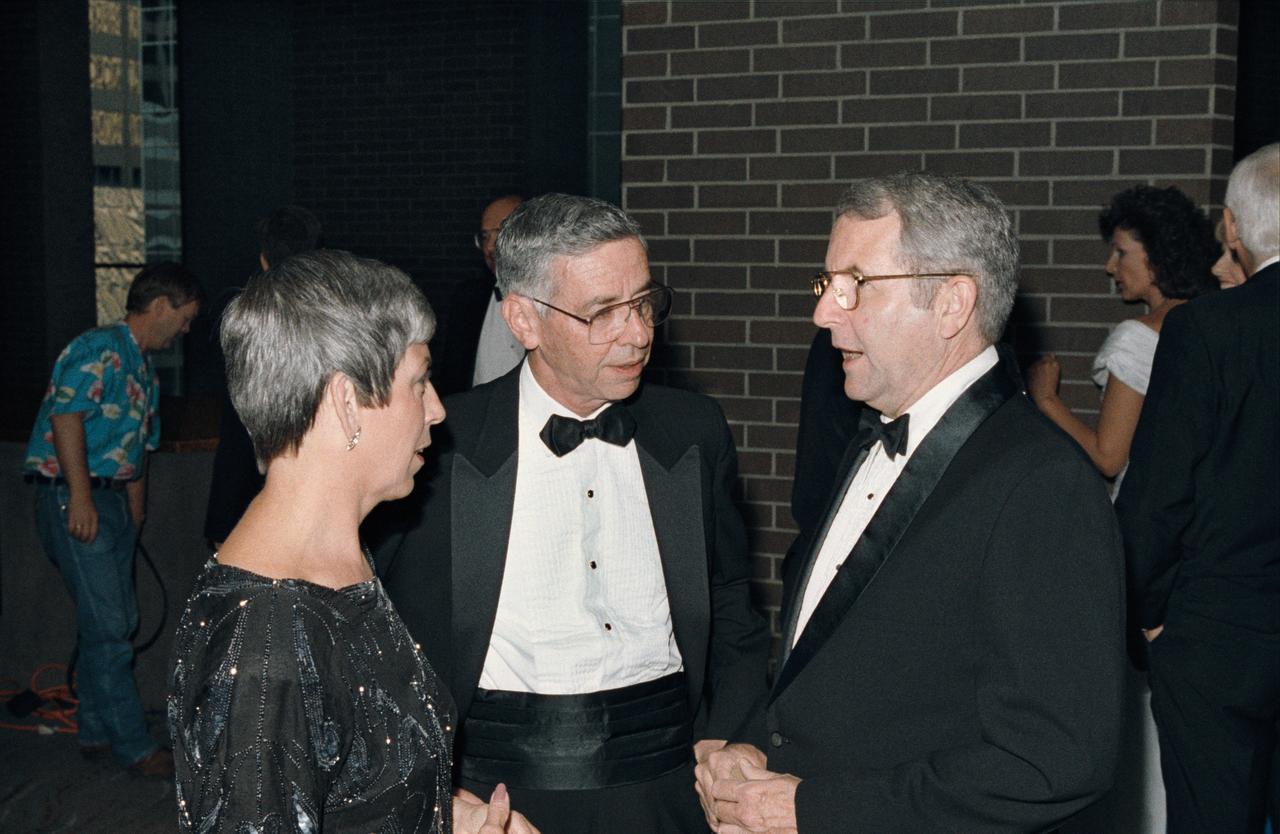 View from the Apollo 11 Twentieth Anniversary Black Tie reception at the downtown Houston Hyatt Regency Hotel. Scene show NASA/JSC Director Aaron Cohen talking with NASA Administrator Richard H. Truly and his wife, Cody.