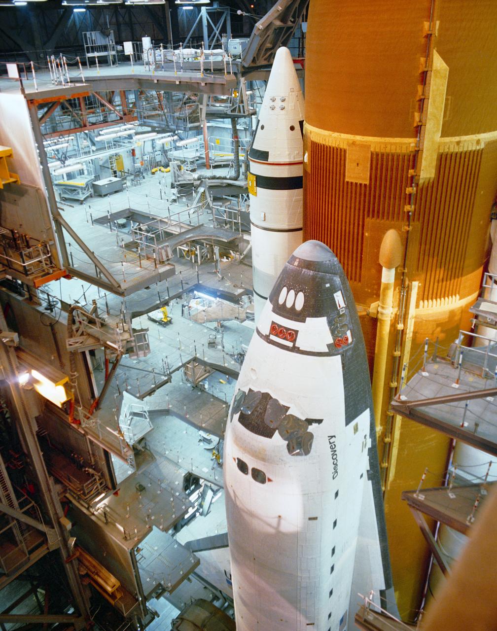 S89-49412 (25 Oct 1989) --- Preparations are underway to rollout the Space Shuttle orbiter Discovery from the Vehicle Assembly Building (VAB) to Pad 39B, as KSC employees work toward the mid-November launch of STS-33, a Department of Defense Devoted mission. Poor weather has thus far hampered attempts to roll out the Discovery and the next attempt is scheduled for midnight tomorrow.