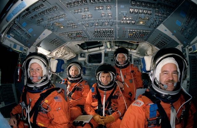 NASA image: STS-36 crewmembers in LESs pose for portrait on JSC's CCT flight deck