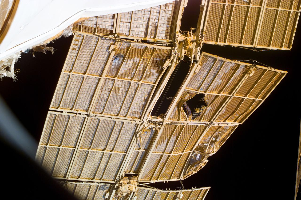 S89-E-5190 (25 Jan 1998) --- This Electronic Still Camera (ESC) image shows the Russian Mir Space Station's damaged solar array panel.  The solar array panel was damaged as a result of an impact with an unmanned Progress re-supply ship which collided with the Mir on June 25, 1997, causing the Spektr Module to depressurize.  This ESC view was taken on January 25, 1998 at 16:56:30 GMT.