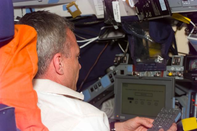 NASA image: HP - Cdr. Wilcutt enters data for a Human Performance (HP) experiment
