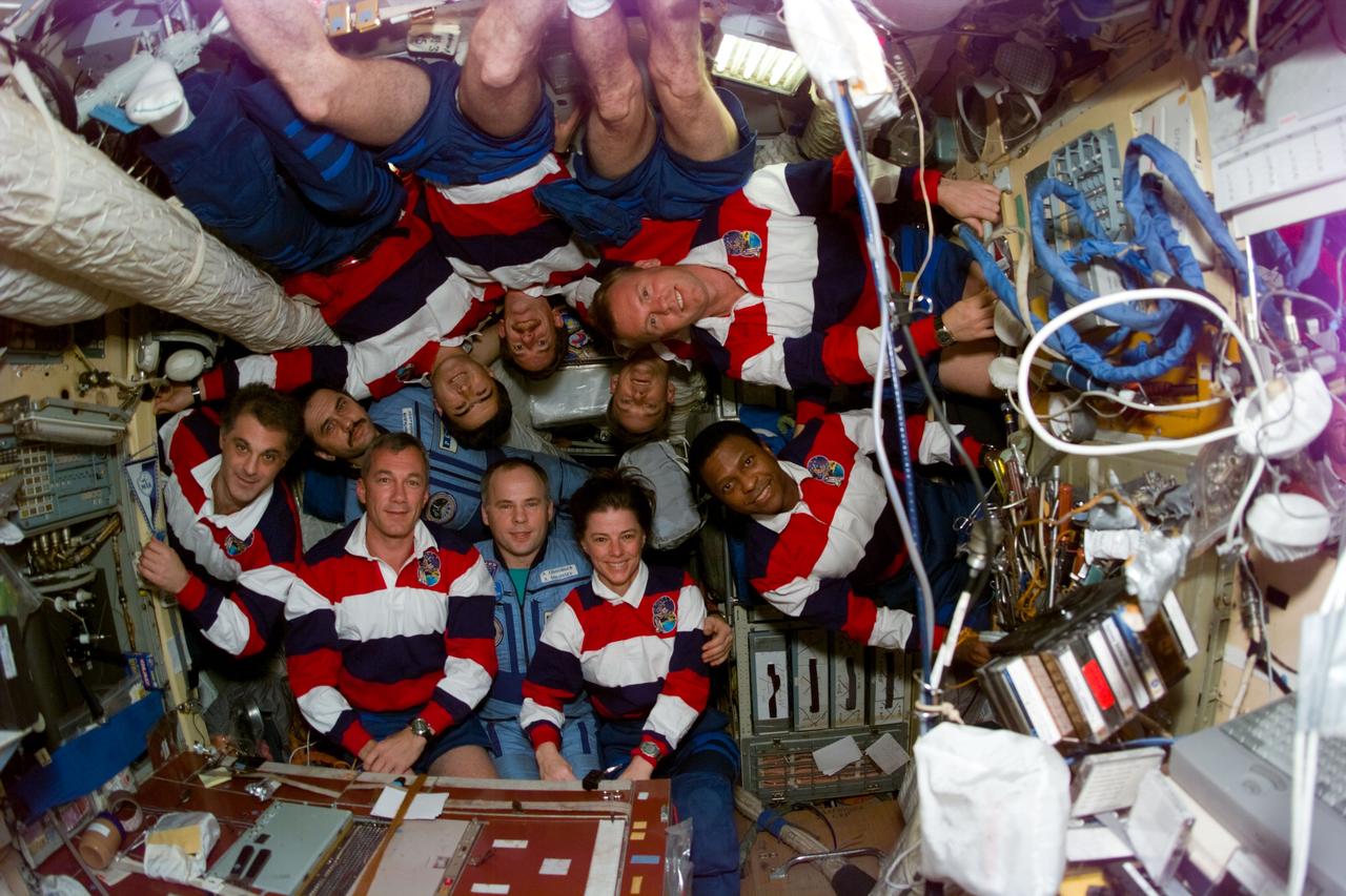 S89-E-5304 (26 Jan 1998) --- This Electronic Still Camera (ESC) image shows the STS-89 and Mir-24 crews posing for their traditional in-flight crew portrait.  They are left to right, astronaut David A. Wolf, former cosmonaut guest researcher; cosmonaut Pavel V. Vinogradov, Mir-24 flight engineer; astronaut Terrence W. Wilcutt, STS-89 commander; cosmonaut Salizan S. Sharipov, payload specialist representing the Russian Space Agency (RSA); cosmonaut Anatoliy Y. Solovyev, Mir-24 commander; astronaut James F. Reilly, mission specialist; mission specialist Bonnie J. Dunbar, payload commander; astronaut Andrew S. W. Thomas (top right), cosmonaut guest researcher; astronaut Joe F. Edwards, Jr., pilot; and astronaut Michael P. Anderson, mission specialist.  This marks the eighth Shuttle/Mir docking mission.  Thomas, replacing Wolf as cosmonaut guest researcher, will be the last American astronaut to serve a tour onboard Mir.  Crew members Solovyev and Dunbar worked together during STS-71, the first Shuttle/Mir docking mission.  This ESC view was taken on January 26, 1998, at 15:45:43 MET.