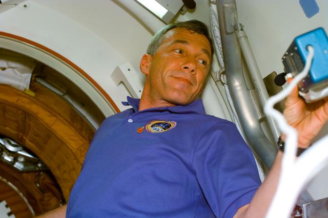 NASA image: STS-89 and Mir 24 crews at the hatch opening