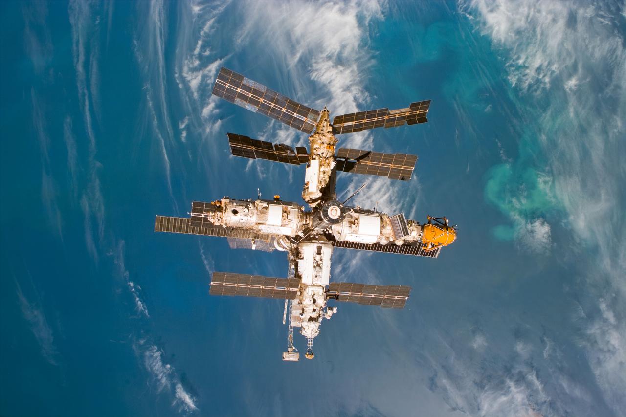 S89-E-5397 (29 Jan 1998) --- Russia's Mir Space Station is backdropped against the blue ocean as it continues to move further and further away from the Space Shuttle Endeavour, from which this electronic still camera (ESC) image was recorded at 18:05:24 GMT, Jan. 29, 1998.