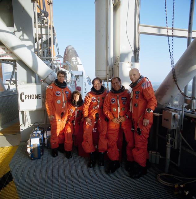 NASA image: STS-33 crewmembers on KSC LC Pad 39B 195 ft level with OV-103 in background