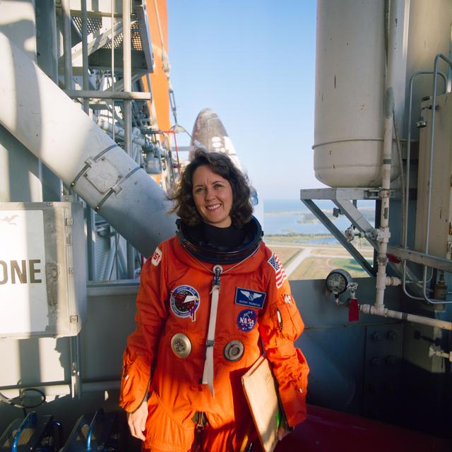 NASA image: STS-33 MS Thornton on KSC LC Pad 39B 195 ft level with OV-103 in background