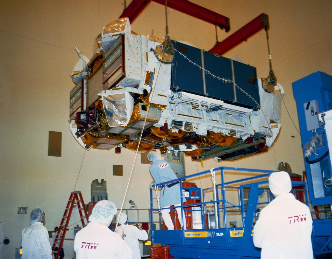 S90-36709 (8 Feb 8, 1990) --- Workers at the Payload Hazardous Servicing Facility are removing the Gamma Ray Observatory from its storage container.  GRO, one of four NASA Great Observatories, arrived at the Kennedy Space Center (KSC) February 6 from the California plant of builder TRW.  Weighing a massive 34,700 pounds, GRO will be the heaviest payload without an upper stage ever carried aboard the space shuttle.  It is scheduled for deployment from the orbiter Atlantis during STS-37 in November 1990.