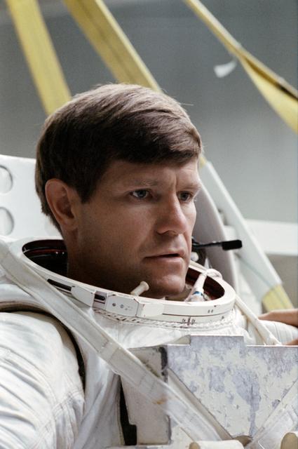 NASA image: STS-39 EMU suited MS McMonagle prepares for simulation at JSC's WETF Bldg 29