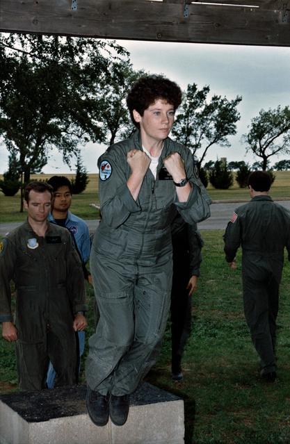 NASA image: ASCAN Helms simulates parachute jump during VAFB training exercises