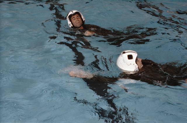 NASA image: ASCANs Helms and Gregory swim in pool during Elgin AFB survival training