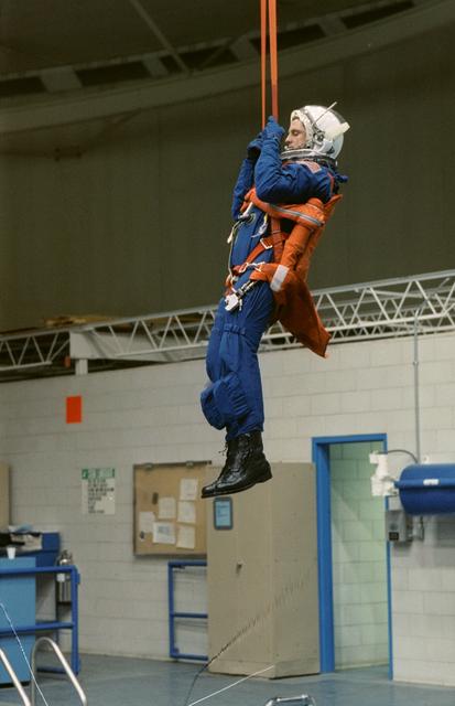 NASA image: STS-39 MS Harbaugh is suspended over JSC's WETF Bldg 29 pool via harness