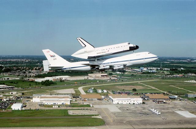 NASA image: Air to air view of Endeavour, OV-105, atop SCA approaches Ellington runway
