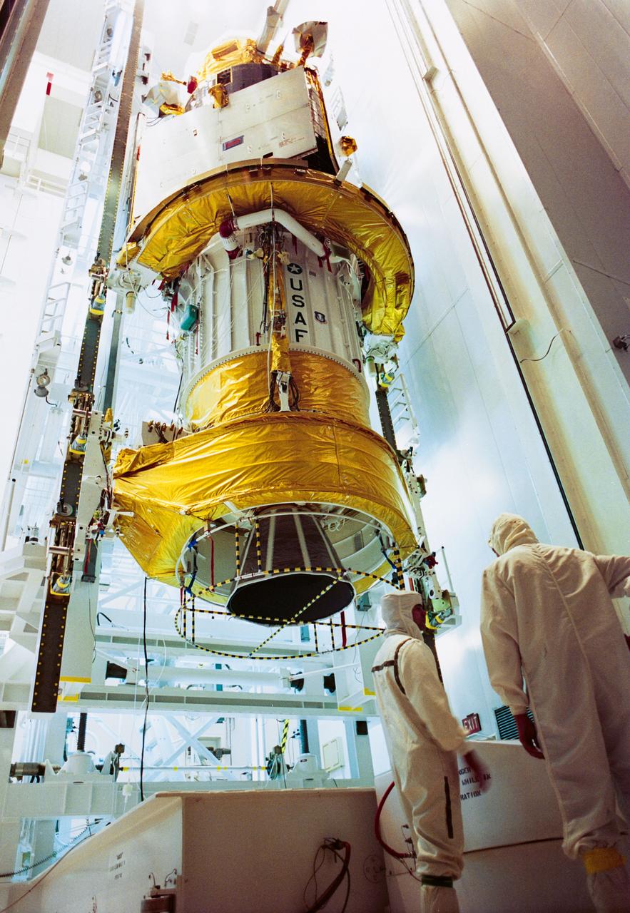 S91-50773 (19 Oct 1991) --- At a processing facility on Cape Canaveral Air Force Station, the Defense Support Program (DSP) satellite is being transferred into the payload canister transporter for shipment to Launch Pad 39A at KSC.  The DSP will be deployed during Space Shuttle Mission STS-44 later this year.  It is a surveillance satellite, developed for the Department of Defense, which can detect missile and space launches, as well as nuclear detonations.  The Inertial Upper Stage which will boost the DSP satellite to its proper orbital position is the lower portion of the payload.  DSP satellites have comprised the spaceborne segment of NORAD's (North American Air Defense Command) Tactical Warning and Attack Assessment System since 1970.  STS- 44, carrying a crew of six, will be a ten-day flight.