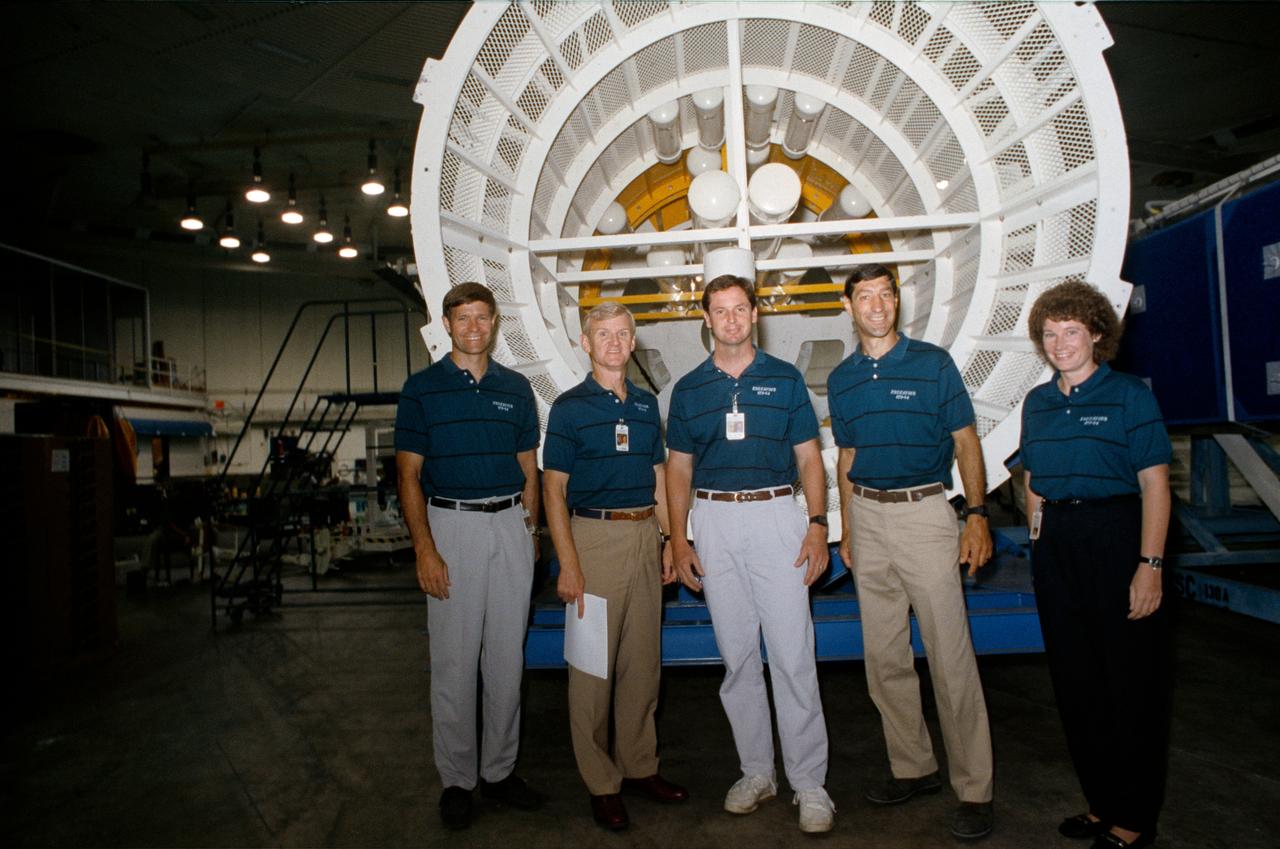 S92-40571 (August 1992) --- The five astronaut crewmembers assigned to fly aboard the Space Shuttle Endeavour for the STS-54 mission, pause for a break during training and preparations for the six-day mission. Left to right are Donald R. McMonagle, pilot; John H. Casper, mission commander; Gregory J. Harbaugh, Mario Runco Jr. and Susan J. Helms, mission specialists. The five are in the weightless environment training facility (WET-F) at the Johnson Space Center (JSC).