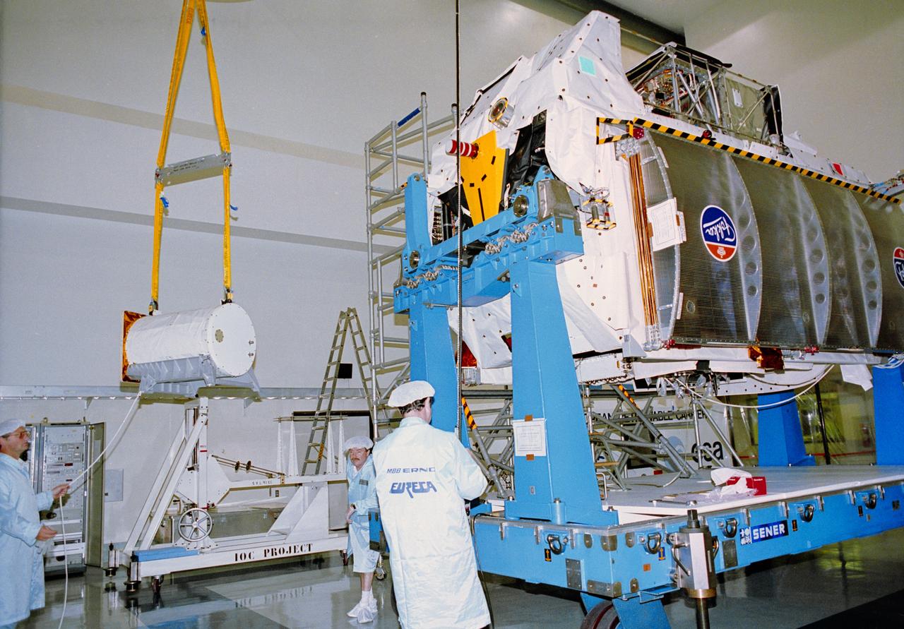 S92-41442 (3 Dec 1991) --- At the Astrotech Space Operations spacecraft processing facility in Titusville, German aerospace workers check out the European Retrievable Carrier (EURECA) after removing it from the shipping container.  The approximately 10,000-pound spacecraft is scheduled to return to KSC next April to undergo final preparations for launch on the STS-46 mission.  Sponsored by the European Space Agency, EURECA is a free-flying reusable research platform that will be deployed during the flight and retrieved at a later date by another Shuttle crew.