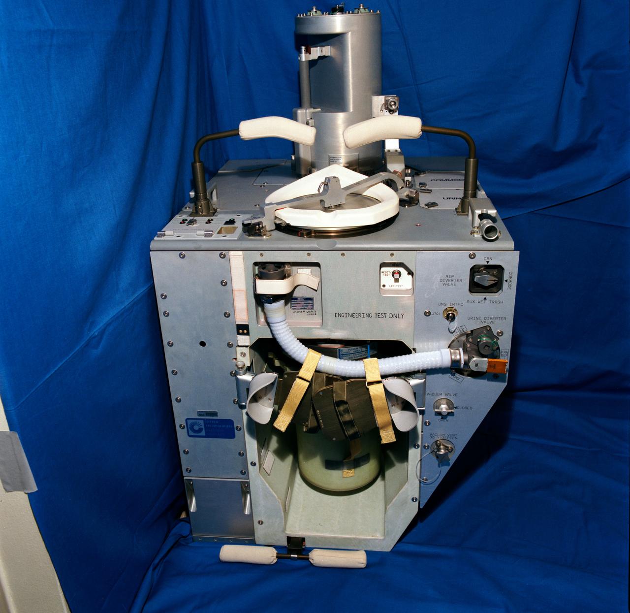 S92-46717 (November 1992) --- A front view of the improved waste collection system (IWCS) scheduled to fly aboard NASA's Space Shuttle Endeavour for the STS-54 mission. Among the advantages the new IWCS is hoped to have over the current WCS are greater dependability, better hygiene, virtually unlimited capacity and more efficient preparation between Shuttle missions. Unlike the previous WCS, the improved version will not have to be removed from the spacecraft to be readied for the next flight.