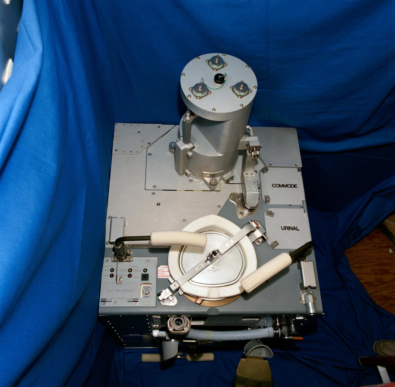 S92-46726 (November 1992) --- A high angle view of the Improved Waste Collection System (IWCS) scheduled to fly aboard NASA's Space Shuttle Endeavour for the STS-54 mission. Among the advantages the new IWCS is hoped to have over the current WCS are greater dependability, better hygiene, virtually unlimited capacity and more efficient preparation between Shuttle missions. Unlike the previous WCS, the improved version will not have to be removed from the spacecraft to be readied for the next flight.