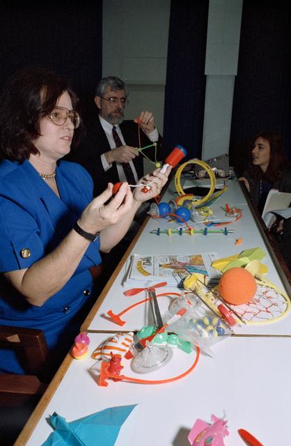 NASA image: Education instructors explain and demonstrate STS-54 DSO 802 toys at JSC