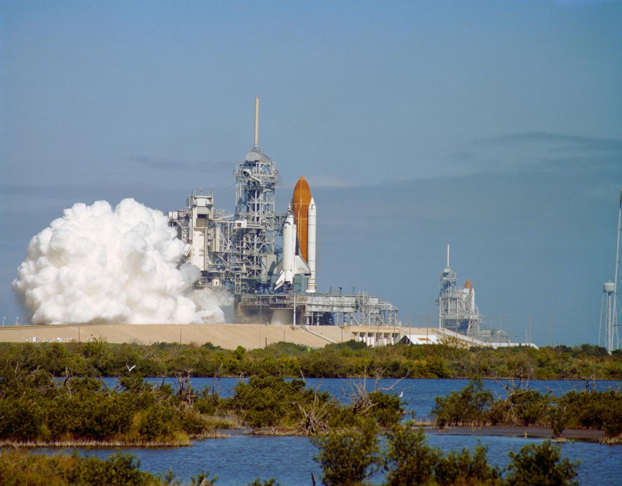 S93-31601 (March 1993) --- The second Space Shuttle launch attempt of 1993 comes to an abrupt halt when one of the three main engines on the orbiter Columbia shuts down at T -3 seconds, resulting in an on-the-pad abort of Mission STS-55.  This was the first time in the post-Challenger era that a main engine shutdown has halted a Shuttle launch countdown, and only the third time in the history of the program.  In 1984, STS-41D was scrubbed at T -4 seconds when the orbiter General Purpose Computer detected an anomaly in a main engine, and in 1985, STS-51F was halted at T -3 seconds due to a main engine malfunction that caused shutdown of all three engines.  Columbia had been scheduled to lift off from Launch Pad 39B is the Space Shuttle Discovery, undergoing preparations for lift off on Mission STS-56.