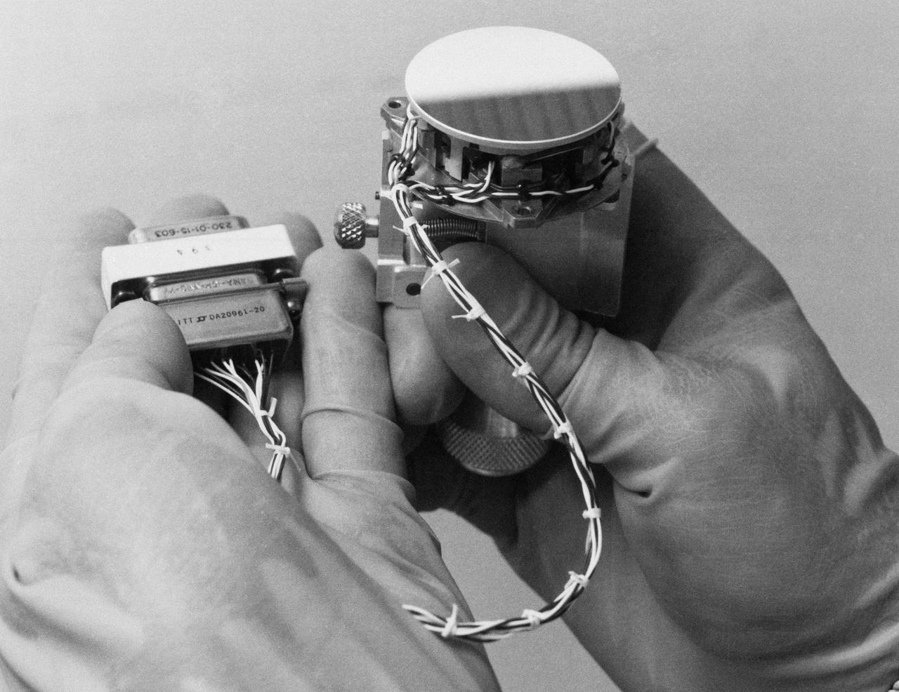 S93-33257 (15 Mar 1993) --- This close-up view features tiny articulating fold mirrors that will go into a replacement camera for the Wide Field\Planetary Camera (WF\PC-1) currently on the Hubble Space Telescope (HST).  A team of NASA astronauts will pay a visit to the HST later this year, carrying with them the new WF/PC-2 to replace the one currently on the HST.  The Jet Propulsion Laboratory (JPL) in Pasadena, California has been working on the replacement system for several months.  See NASA photo S93-33258 for an optical schematic diagram of one of the four channels of the WF\PC-2 showing the path taken by beams from the HST before an image is formed at the camera's charge-coupled devices.