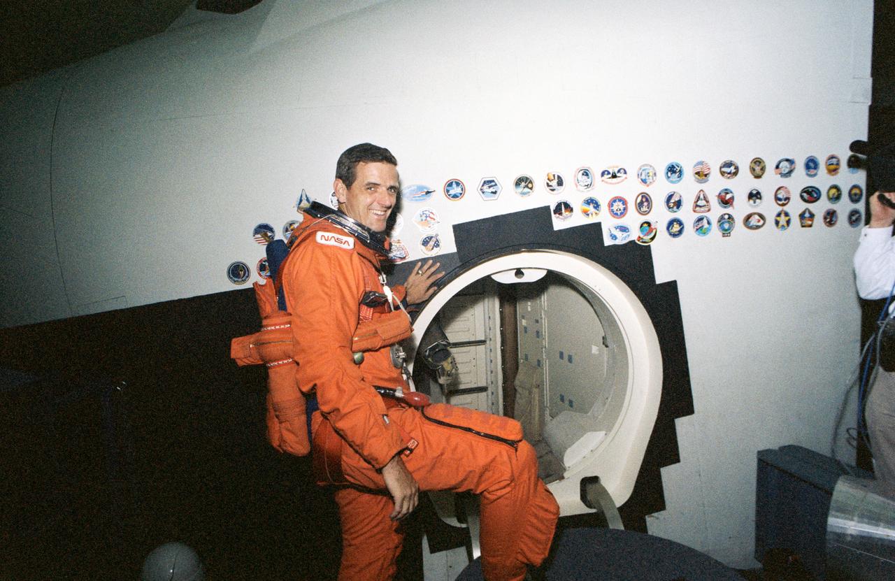 S93-38686 (20 July 1993) --- Wearing a training version of the partial pressure launch and entry garment, astronaut William S. McArthur prepares to rehearse emergency egress procedures for the STS-58 mission.  McArthur, along with the five other NASA astronauts and a visiting payload specialist assigned to the seven-member crew, later simulated contingency evacuation procedures.  Most of the training session took place in the crew compartment and full fuselage trainers of the Space Shuttle mockup and integration laboratory.