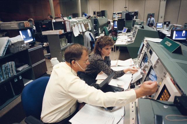 NASA image: Astronauts Ross and Helms at CAPCOM station during STS-61 simulations