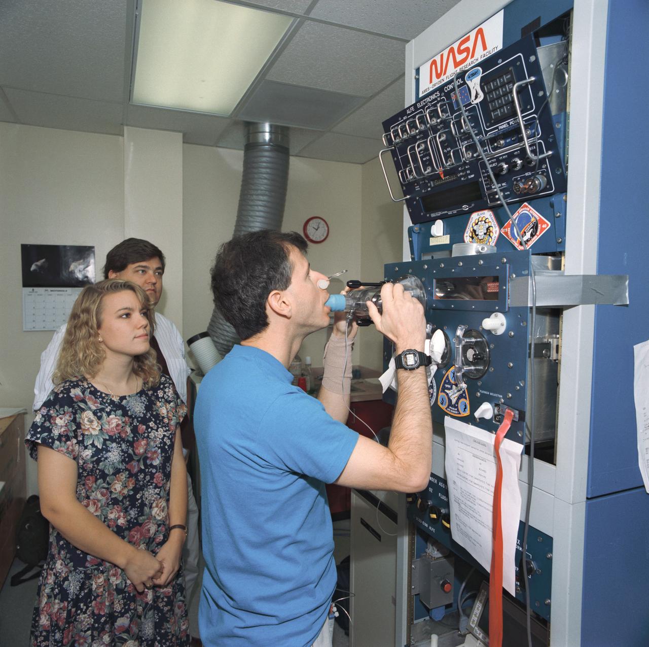 S93-45369 (29 Sept 1993) --- Training on the pre-breathing assembly, Martin J. (Marty) Fettman, DVM, inhales a predetermined gas composition.  A gas analyzer mass spectrometer determines the composition of the gases he exhales.  The re-breathing assembly and gas analyzer system are part of an investigation that explores how lung function is altered in space flight.  The payload specialist for the Spacelab Life Sciences (SLS-2) mission was participating with six NASA astronauts, also assigned to STS-58, for data collection and training.