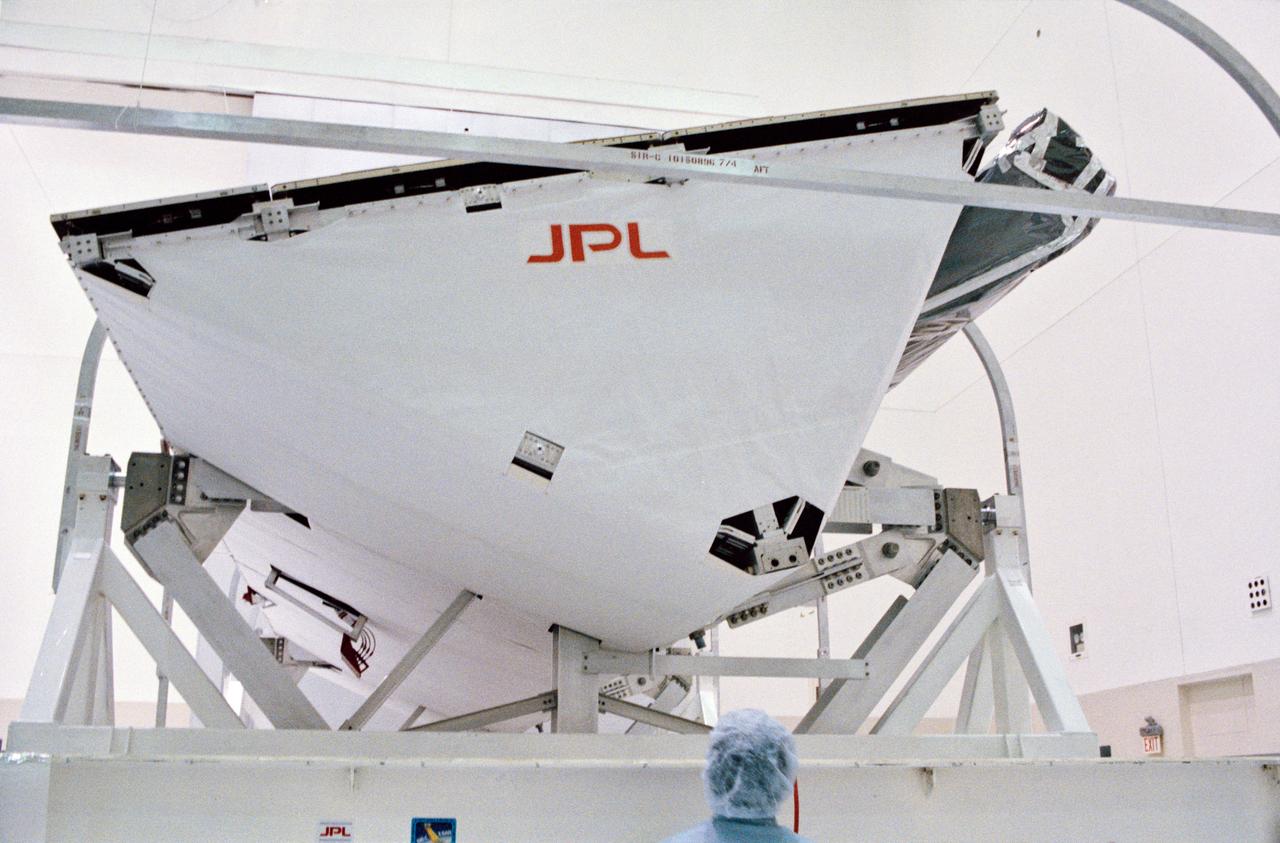 S93-48551 (October 1993) --- The Spaceborne Imaging Radar-C and X-Band Synthetic Aperture Radar (SIR-C/X-SAR) antenna, developed by the Jet Propulsion Laboratory (JPL) as part of NASA's Mission to Planet Earth (MTPE), will fly aboard the Space Shuttle Endeavour.  The radar antenna uses microwave energy which gives it the ability to collect data over virtually any region at any time, regardless of weather or sunlight conditions.  The radar waves can penetrate clouds, and under certain conditions the radar can also see through vegetation, ice and dry sand.  In many cases, spaceborne radar is the only way scientists can explore large-scale and inaccessible regions of the Earth's surface.  SIR-C/X-SAR uses three microwave wavelengths: L-Band (24 cm), C-Band (6 cm) and X-Ban (3 cm).  The multi-frequency data will be used by the international scientific community to monitor global environmental processes with a focus on climate change.  The MTPE spaceborne data, complemented by aircraft and ground studies, will give scientists clearer insights into those environmental changes which are caused by nature and those changes which are induced by human activity.