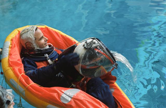 NASA image: Astronaut Kevin P. Chilton uses helmet to bail water during bailout training