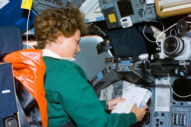NASA image: Commander Collins seated in the flight deck commander's station
