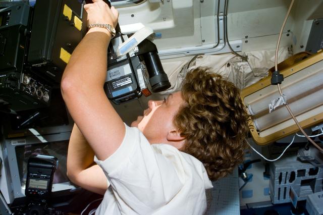 NASA image: Collins takes photographs of the Earth using a 70mm Hasselblad camera
