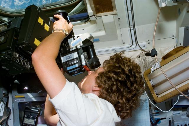 NASA image: Collins takes photographs of the Earth using a 70mm Hasselblad camera