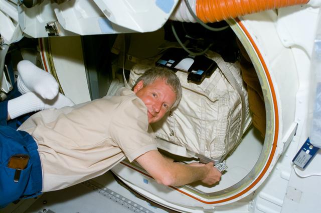 NASA image: MS Hawley packs a stowage bag into the airlock of Columbia