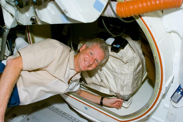 NASA image: MS Hawley packs a stowage bag into the airlock of Columbia