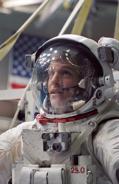 Astronaut Scott Parazynski is prepares to be submerged in the WETF