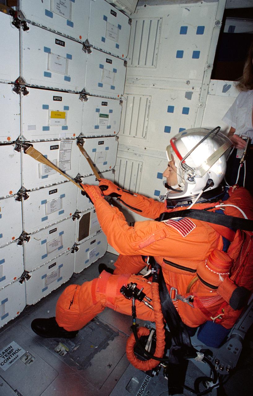 S94-40074 (23 June 1994) --- Astronaut Jean-Francois Clervoy, STS-66 international mission specialist, sits securely on a collapsible seat on the middeck of a Shuttle trainer during a rehearsal of procedures to be followed during launch and entry phases of his scheduled November flight.  This rehearsal, held in the crew compartment trainer of the Johnson Space Center's (JSC) Shuttle Mockup and Integration Laboratory, was followed by a training session on emergency egress procedures.  Clervoy, a European astronaut, will join five NASA astronauts for a week and a half aboard the Space Shuttle Atlantis in Earth-orbit in support of the Atmospheric Laboratory for Applications and Science (ATLAS-3).