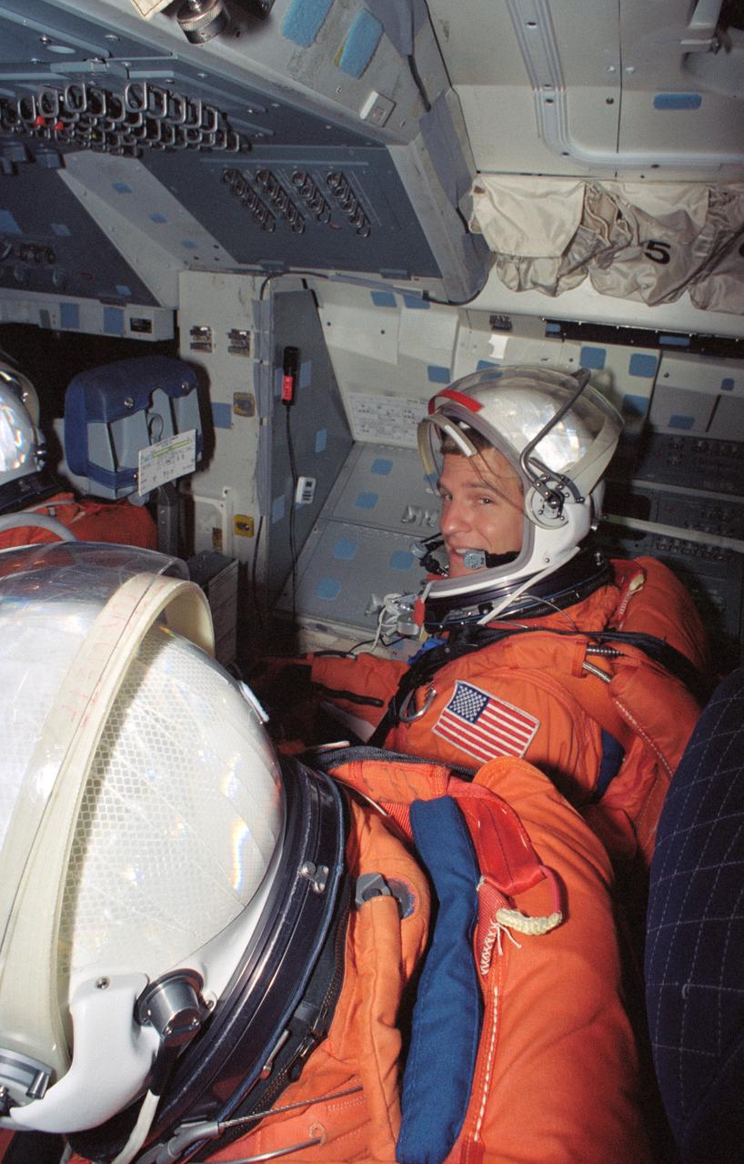 S94-40079 (23 June 1994) --- Astronaut Scott E. Parazynski looks at fellow STS-66 mission specialist Joseph R. Tanner, (partially visible in foreground) during a rehearsal of procedures to be followed during launch and entry phases of the their scheduled November flight.  This rehearsal, held in the Crew Compartment Trainer (CCT) of the Johnson Space Center's (JSC) Shuttle Mockup and Integration Laboratory, was followed by a training session on emergency egress procedures.  In November, Parazynski and Tanner will join three other NASA astronauts and a European mission specialist for a week and a half aboard the Space Shuttle Atlantis in Earth-orbit in support of the Atmospheric Laboratory for Applications and Science (ATLAS-3).
