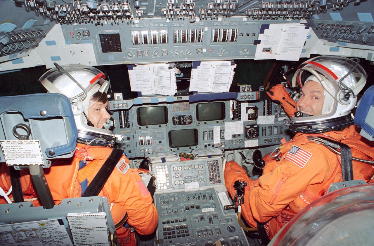 S94-40090 (23 June 1994) --- Astronauts Donald R. McMonagle, left, and Curtis L. Brown man the commander's and pilot's stations, respectively, during a rehearsal of ascent and entry phases of their scheduled November 1994 flight aboard Atlantis. Three other NASA astronauts and a European mission specialist joined the two for this training exercise in the Crew Compartment Trainer (CCT) at the Johnson Space Center's (JSC) Shuttle Mockup and Integration Laboratory and will join them aboard the Space Shuttle Atlantis in November. The flight is manifest to support the Atmospheric Laboratory for Applications and Science (ATLAS-3) mission.