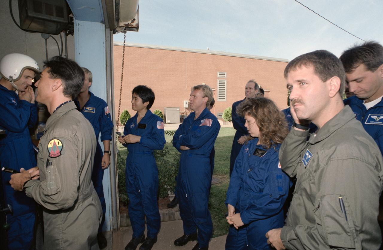 S95-00356 (14 September 1992) --- Several 1992 astronaut candidates wait in line to receive gear for one of several phases of parachute familiarization and survival training at Vance Air Force Base in Oklahoma. Recognizable in the picture are Jerry M. Linenger, Scott E. Parazynski, Koichi Wakata, Andrew S. W. Thomas, Mary Ellen Weber, Joseph R. Tanner, John M. Grunsfeld and Richard M. Linnehan.