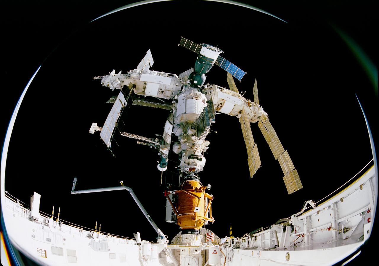 S95-22116 (15 Nov 1995) --- The Space Shuttle Atlantis has completed its successful docking with the Russia's Mir Space Station.  The STS-74 crew members inside Atlantis' cabin are making preparations to meet with the Mir-20 crew members.  During the STS-74 mission, the crew used an IMAX camera to document the Space Shuttle Atlantis' rendezvous and docking with the Mir Space Station.  The 65mm camera system was located in the Atlantis' cargo bay and provided a unique fish-eye perspective.  These images were selected from footage that will be incorporated in a large-format feature film about NASA's cooperative program with the Russians.  NASA has flown IMAX camera systems on many Shuttle missions, including the recent STS-63 Shuttle-Mir rendezvous and STS-71 Shuttle-Mir docking.  Film from previous missions was used to create the productions The Dream is Alive, The Blue Planet, and Destiny in Space.
