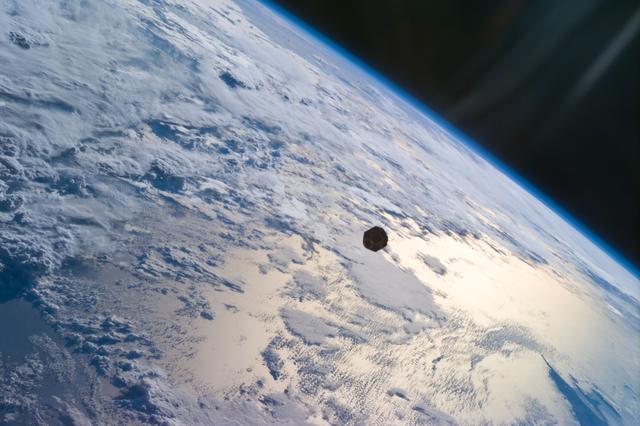 NASA image: PANSAT satellite deployment from STS-95 Discovery's payload bay