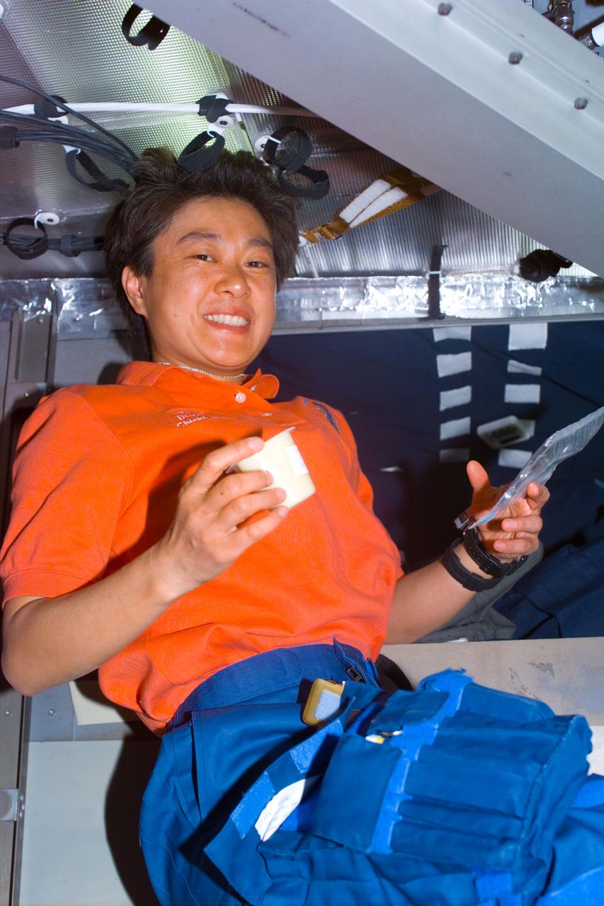 STS095-E-5053 (30 Oct. 1998) --- STS-95 payload specialist Chiaki Mukai continues her experimentation onboard the Space Shuttle Discovery during Flight Day 2 of a schedule nine-day mission. The photo was taken with an electronic still camera (ESC) at 10:42:38 GMT, Oct. 30.