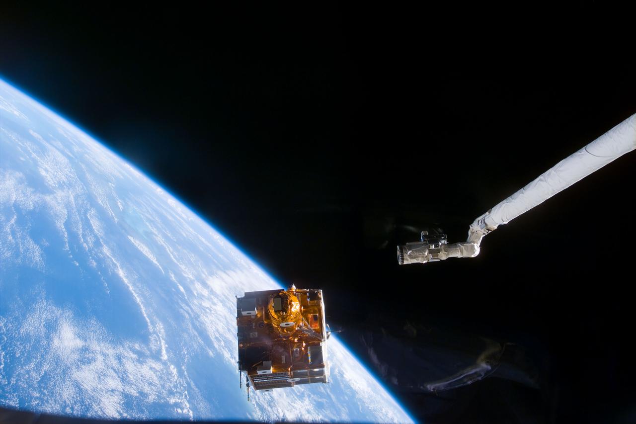 STS095-E-5071 (1 Nov. 1998) --- Backdropped against the blackness of space and Earth's horizon, Spartan 201-05 leaves the cargo bay of the Space Shuttle Discovery. The satellite will remain a free-flyer for several days while it records data on the solar wind and the sun's corona. This data is hoped to increase knowledge of the sun's effect on our planet. The Canadian-built remote manipulator system (RMS)is partially visible in the frame. The photograph was taken with an electronic still camera (ESC) at 2:08:48 GMT, November 1.