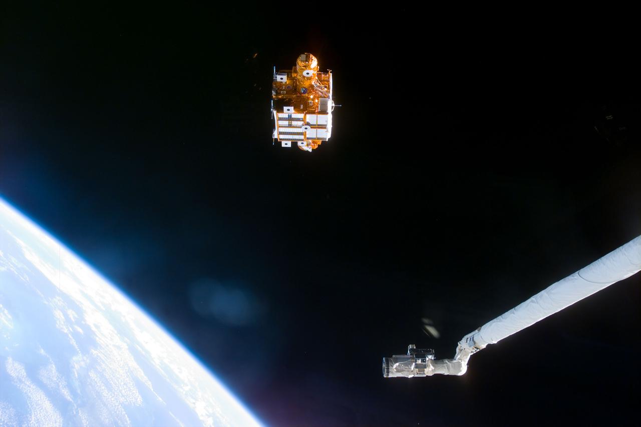 STS095-E-5082 (1 Nov. 1998) --- Backdropped against the blackness of space, Spartan 201-05 leaves the cargo bay of the Space Shuttle Discovery. The satellite will remain a free-flyer for several days while it records data on the solar wind and the sun's corona. This data is hoped to increase knowledge of the sun's effect on our planet. The Canadian-built remote manipulator system (RMS)is partially visible in the frame. The photograph was taken with an electronic still camera (ESC) at 2:10:31 GMT, November 1.