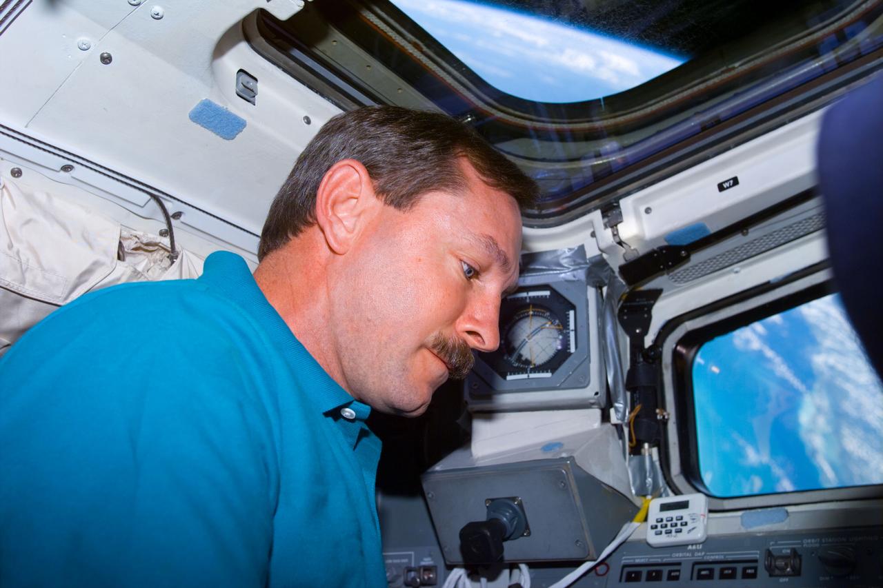 STS095-E-5100 (1 Nov. 1998) --- Astronaut Curtis L. Brown Jr., STS-95 commander, on aft flight deck, as photographed with an electronic still camera (ESC) at 02:12:00 GMT, Nov. 1.